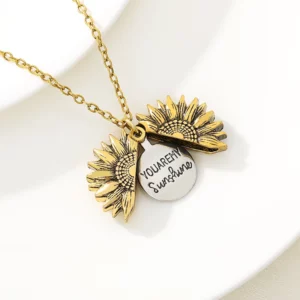 a sunflower necklace with you are my sunshine engraved pendant inside